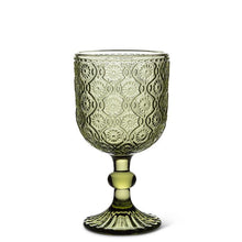 Olive green ine goblet with embossed daisy design on white background