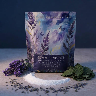 Coconut milk bath product with 'Summer Nights' label surrounded by lavender and leaves on a dark background