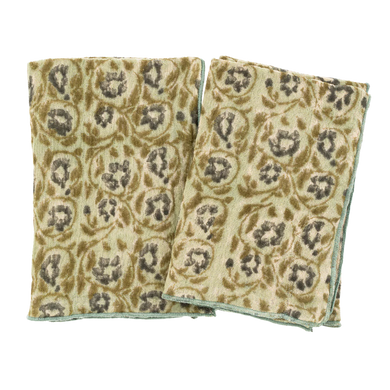 Two patterned cloths stacked on a white background