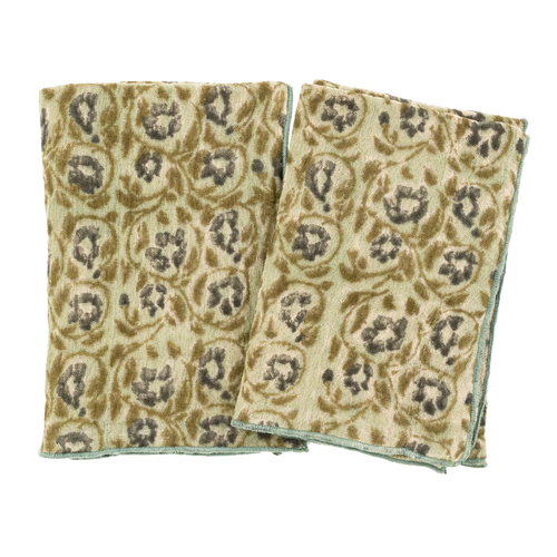 Two patterned cloths stacked on a white background
