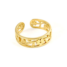 A gold-colored open bangle ring with an intricate filigree floral pattern, displayed on a clean white background.
