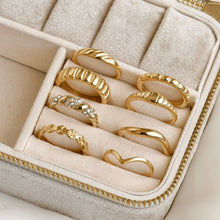 Set of gold rings in a jewelry box