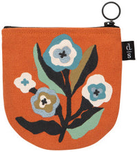 Orange zippered pouch with floral design on a white background
