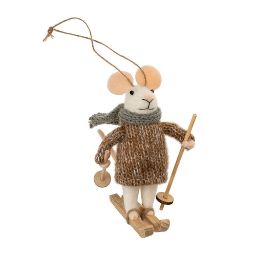 Decorative mouse ornament wearing a sweater and scarf, holding skis and ski poles, on a white background.