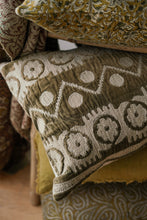 olive green Patterned cushions with a focus on texture and design.