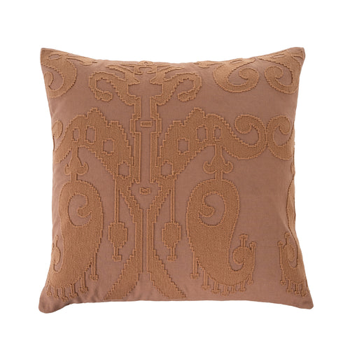 Rose coloured decorative pillow with intricate pattern on a beige background