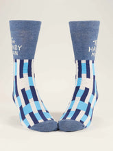 Pair of blue and white patterned socks on a light gray background