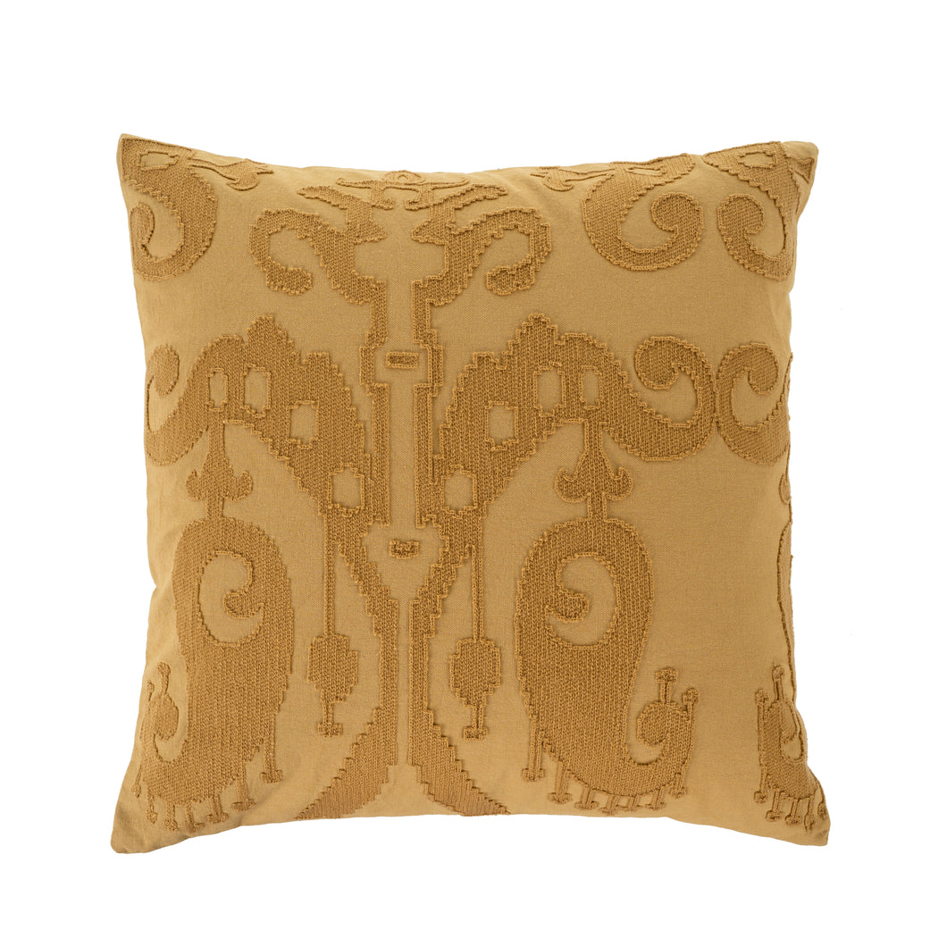 Ochre colored cushion with ikat embroidery print on white background
