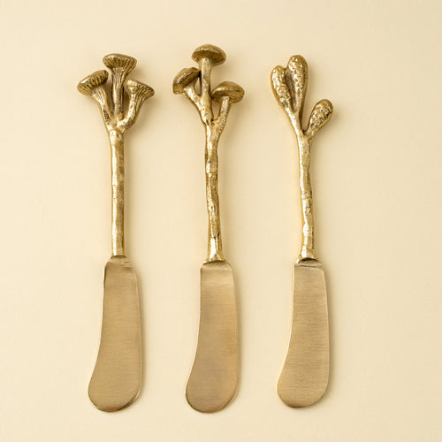 Gold spreader knives with mushroom shaped handles
