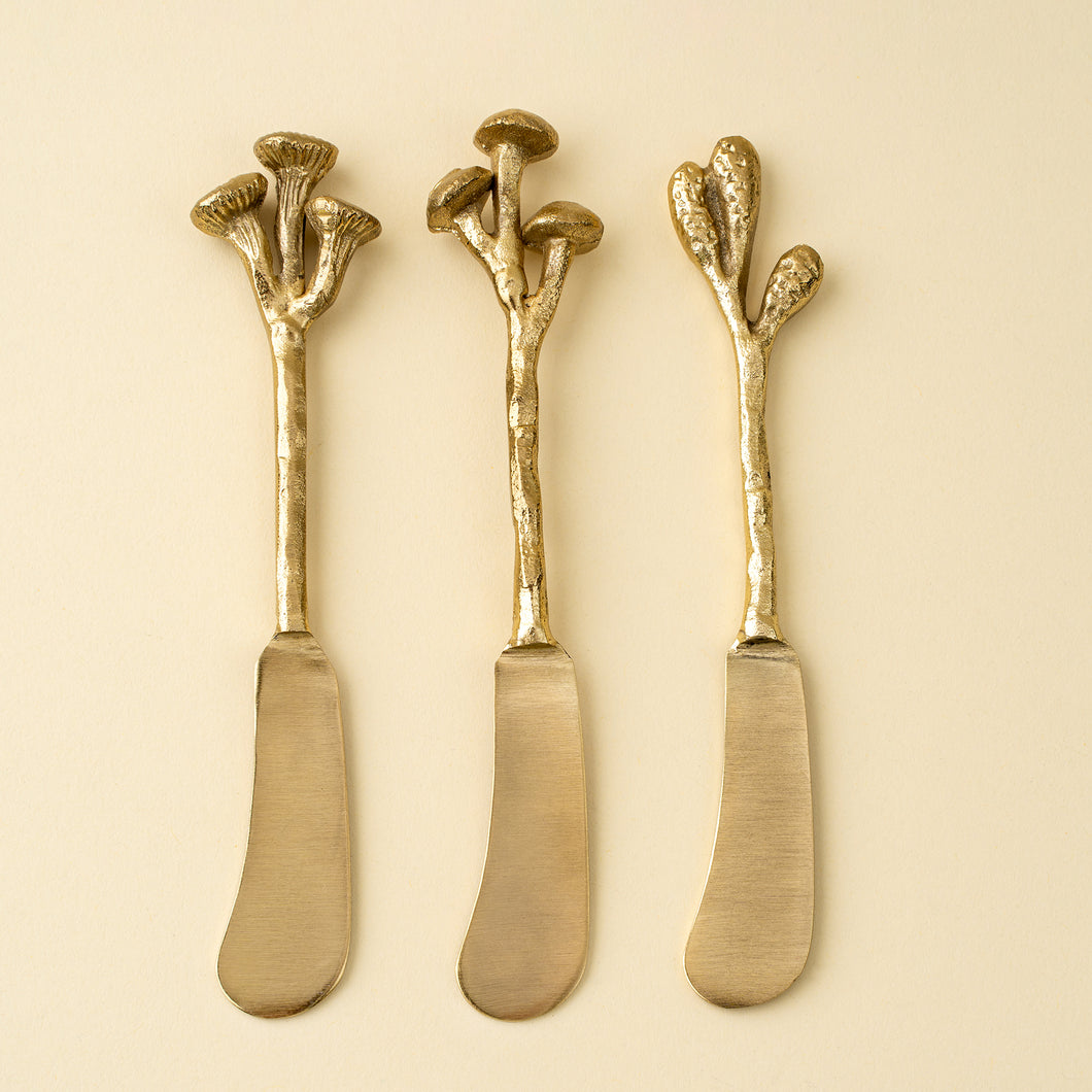 Gold spreader knives with mushroom shaped handles