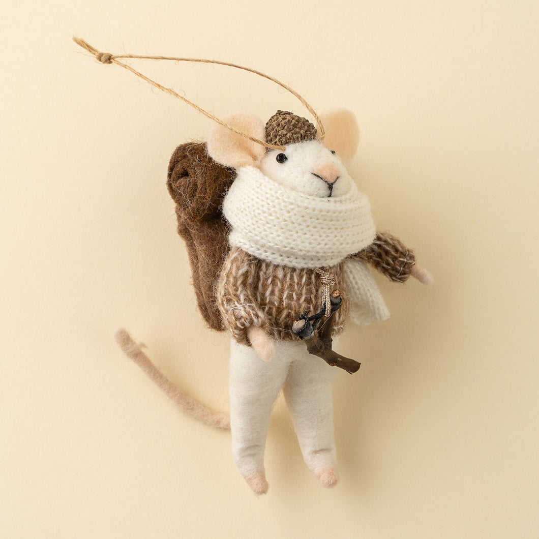 Felt moue ornament wearing a large scarf carrying a backpack and slingshot