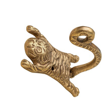 Gold colored metal hook shaped like a tiger
