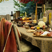 Table decorated for a fall harvest supper 