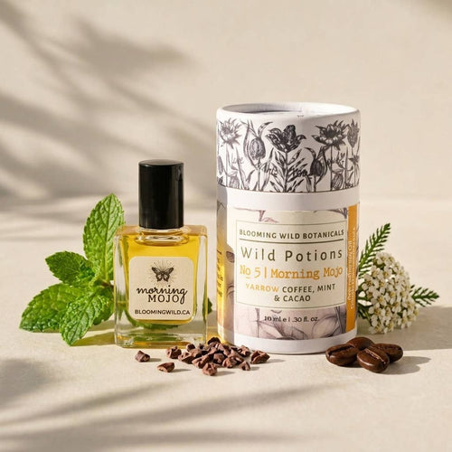Bottle and packaging of 'Morning Mojo' with botanical elements on a neutral background