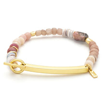 Bracelet with multicolored beads and gold clasp on a white background
