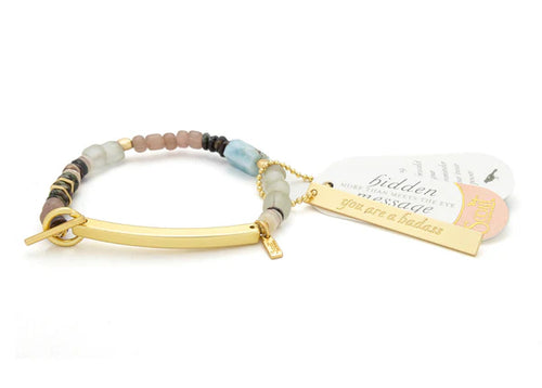 Bracelet with beads and gold clasp on a white background