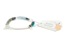 Bracelet with beads and a tag on a white background