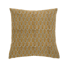 Muted blue and ochre throw pillow with decorative floral pattern