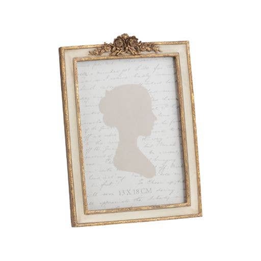 Gold nad Cream Ornate Frame With Floral Gold Topper Against White Background