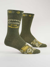 Grey socks with yellow text and patterns on a white background