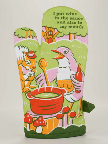Colorful oven mitt with cartoon characters and humorous text on a white background