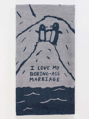 Towel with penguins on a mountain and text 'I love my boring-ass marriage' on a gray background