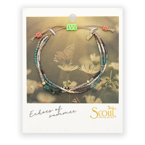 Beaded bracelet on a Scout branded card with a nature-themed background