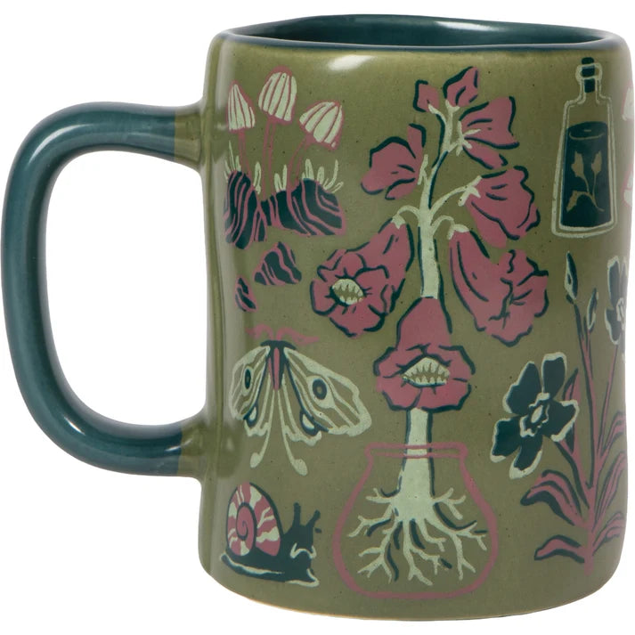 Mug with floral and nature-themed design on a white background