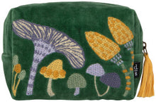 Green pouch with embroidered mushrooms on a green background