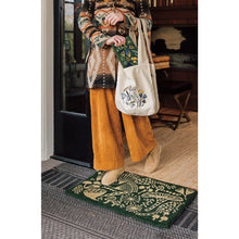 Danica Canada decorative doormat with forest-themed design featuring animals and plants on a green background