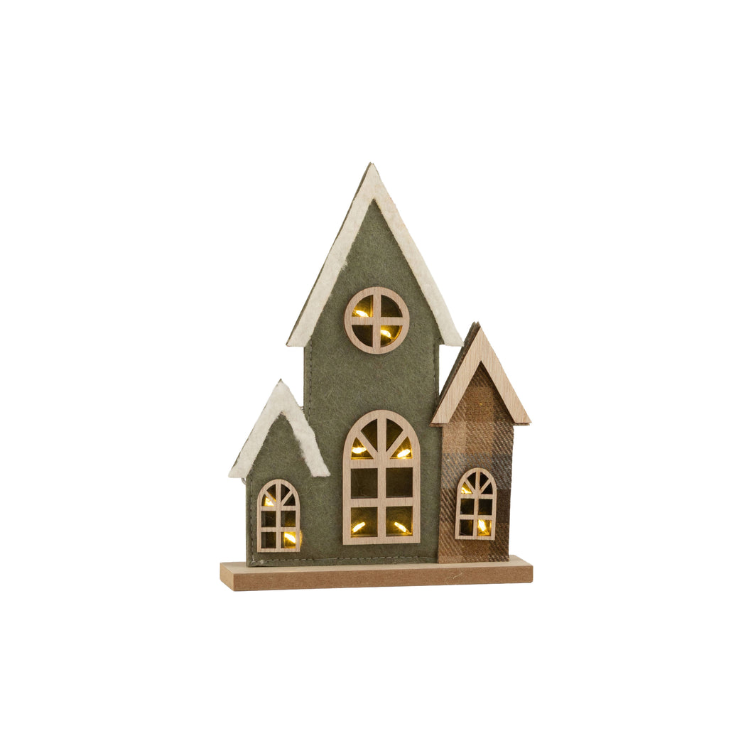 A small decorative house-shaped lighted ornament with a dark green textured exterior, light wood trim, and warm yellow lights glowing from the windows, shown on a plain white background.
