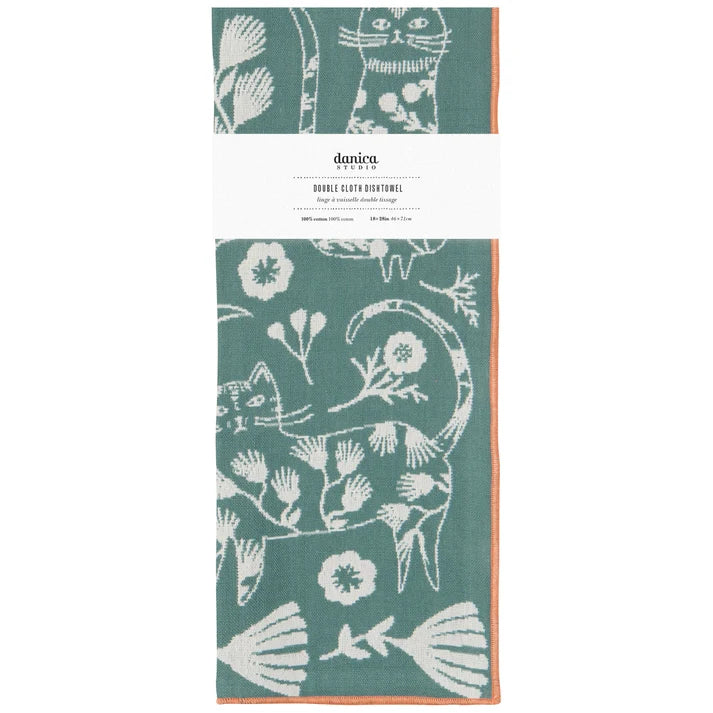 Danica double cloth dishtowel in sage green with a white cat and floral pattern, wrapped in a white paper band.