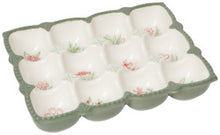 Ceramic egg holder with floral pattern details