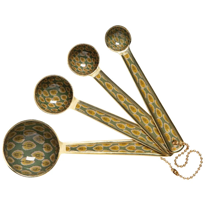 Set of decorative measuring spoons with a patterned design on a white background
