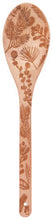 Wooden spoon with shell pattern on a wooden background