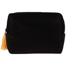 A black velvet cosmetic pouch with a gold tassel zipper pull, shown against a plain white background.