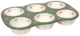 Muffin tin with floral design on a green background